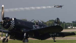 Grumman F8F Bearcat over Vought F4U Corsair