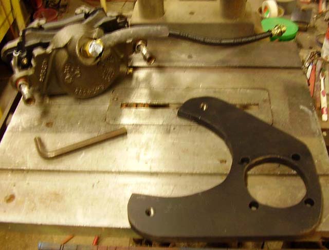 New caliper bracket and caliper assy.